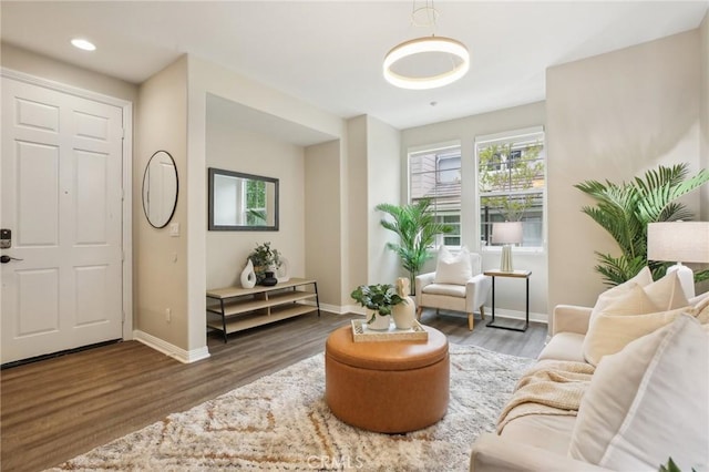 interior space featuring baseboards, wood finished floors, and recessed lighting