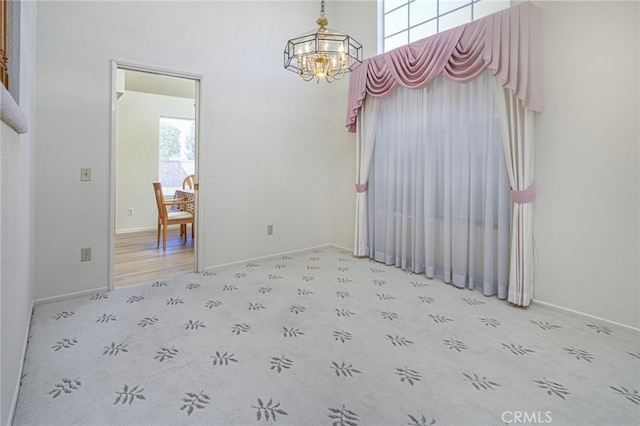 6721 Silver Oak Pl, Riverside, CA 92506 - dining space with baseboards and a notable chandelier