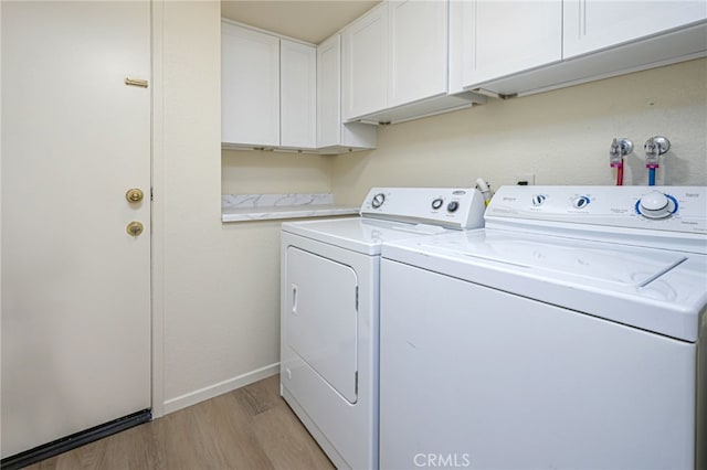 6721 Silver Oak Pl, Riverside, CA 92506 - laundry area featuring baseboards, cabinet space, light wood-style floors, and independent washer and dryer