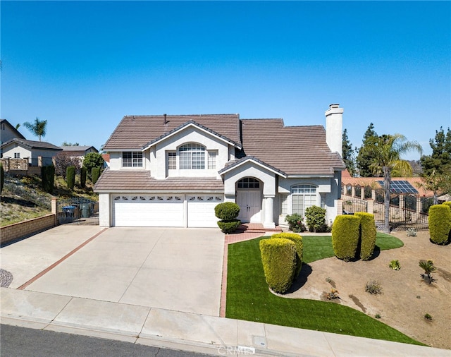 6721 Silver Oak Pl, Riverside, CA 92506 - traditional-style home featuring fence, a tiled roof, stucco siding, an attached garage, and driveway
