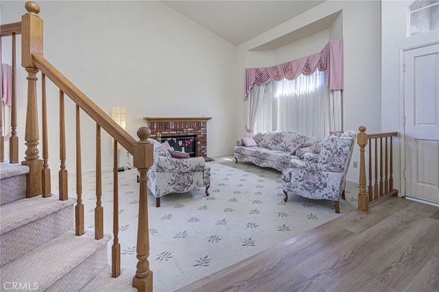 6721 Silver Oak Pl, Riverside, CA 92506 - living area featuring a fireplace, wood finished floors, and lofted ceiling
