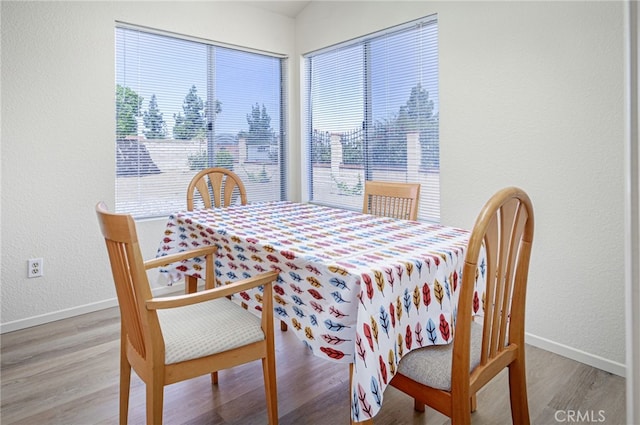 6721 Silver Oak Pl, Riverside, CA 92506 - dining space featuring plenty of natural light, a textured wall, baseboards, and wood finished floors