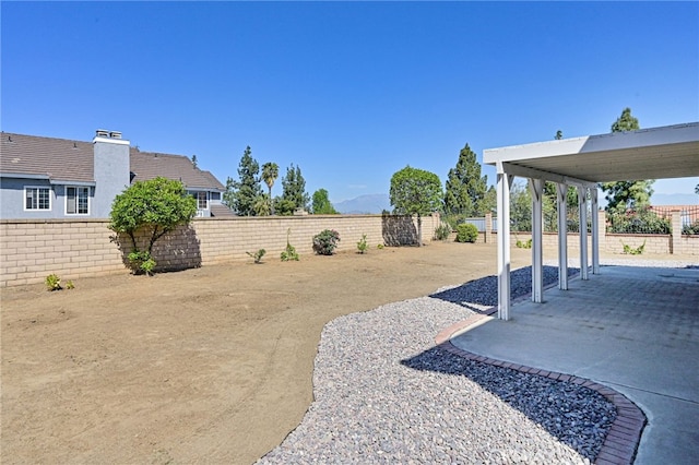 6721 Silver Oak Pl, Riverside, CA 92506 - view of yard featuring a fenced backyard and a patio area