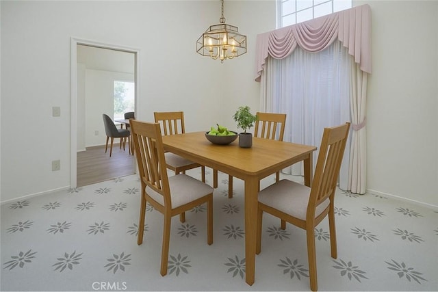 6721 Silver Oak Pl, Riverside, CA 92506 - dining room featuring a chandelier, baseboards, and light floors