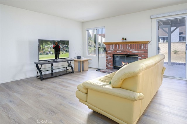 6721 Silver Oak Pl, Riverside, CA 92506 - living area with a fireplace, wood finished floors, and baseboards