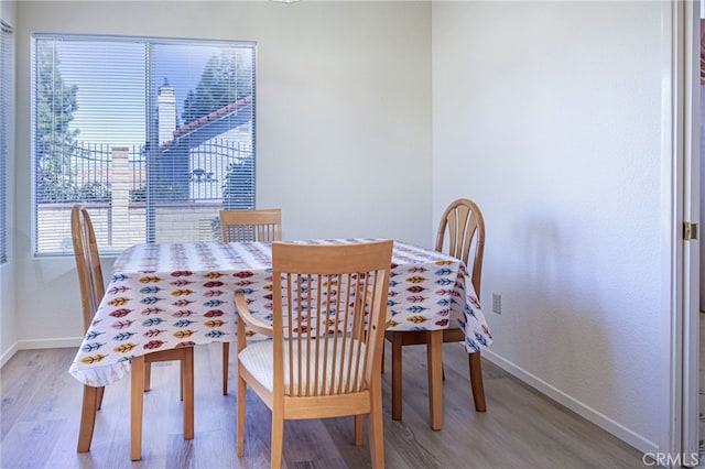 6721 Silver Oak Pl, Riverside, CA 92506 - dining room featuring baseboards and light wood-type flooring