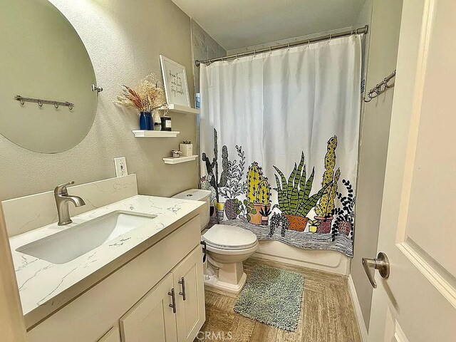 642 W Wilson St, Costa Mesa, CA 92627 - bathroom featuring vanity, toilet, and a textured wall