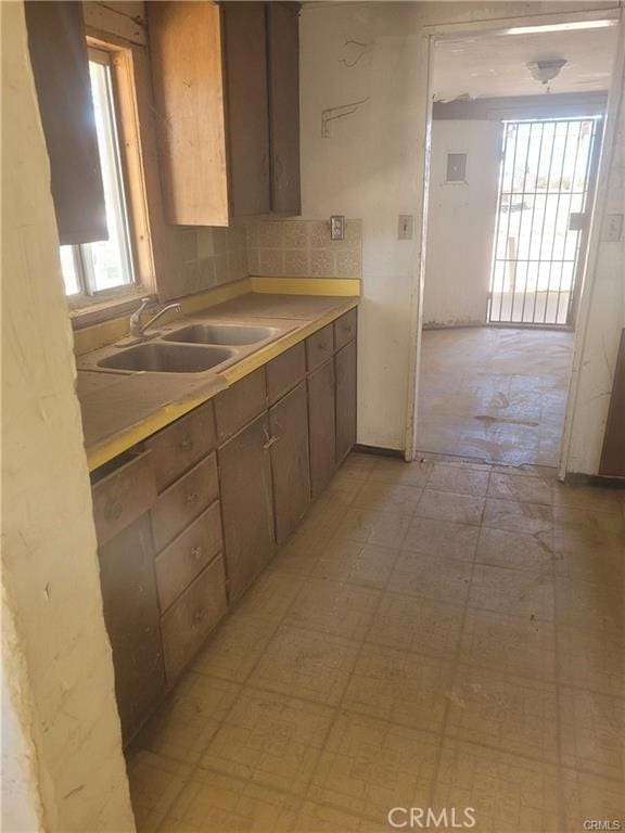 21284 Santa Fe Ave, Hinkley, CA 92347 - kitchen with light countertops, dishwasher, light floors, and a sink