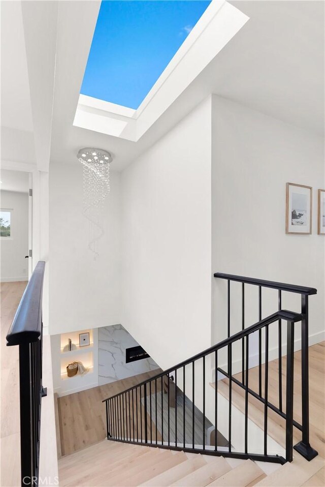 786 Carhart Ave, Fullerton, CA 92833 - staircase with a skylight, wood finished floors, and a chandelier