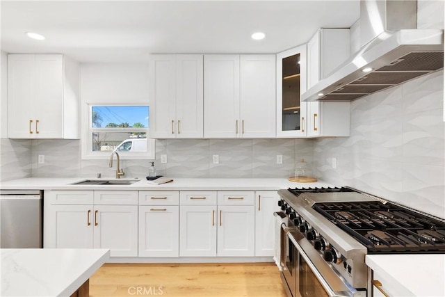 786 Carhart Ave, Fullerton, CA 92833 - kitchen with wall chimney range hood, stainless steel appliances, white cabinetry, glass insert cabinets, and recessed lighting