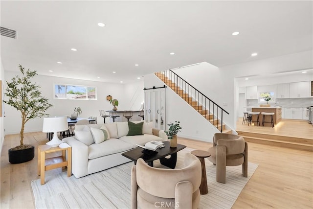 786 Carhart Ave, Fullerton, CA 92833 - living area with a barn door, light wood-type flooring, recessed lighting, and stairway