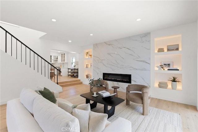 786 Carhart Ave, Fullerton, CA 92833 - living area with recessed lighting, built in shelves, stairs, light wood finished floors, and a fireplace