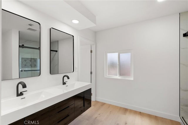 786 Carhart Ave, Fullerton, CA 92833 - bathroom with wood finished floors, double vanity, a shower, and recessed lighting