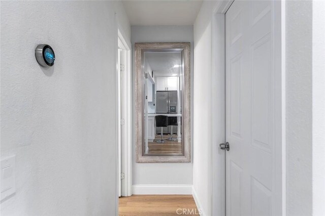 28691 Via Las Flores Unit 328, Murrieta, CA 92563 - hall featuring baseboards and light wood finished floors