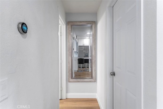 28691 Via Las Flores Unit 328, Murrieta, CA 92563 - hall with baseboards and light wood finished floors