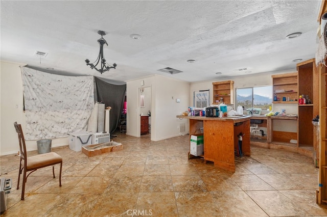 interior space featuring baseboards, visible vents, and crown molding