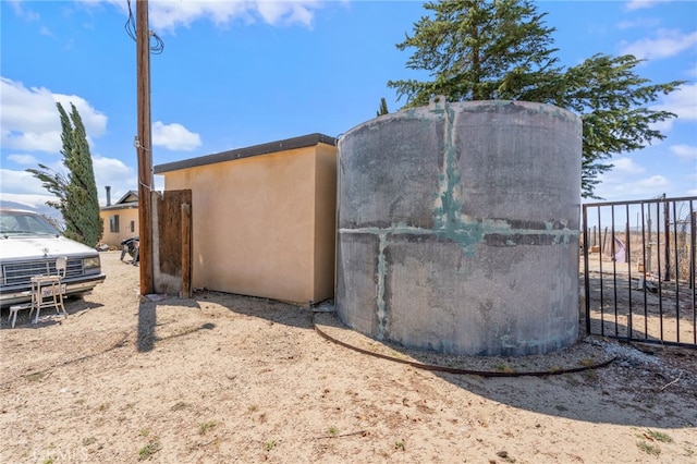 view of outdoor structure with fence