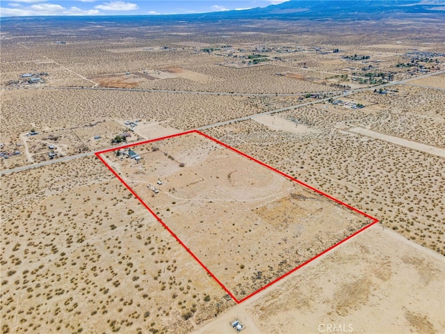 birds eye view of property with a rural view, a desert view, and a mountain view