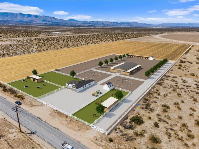 birds eye view of property with a rural view and a mountain view