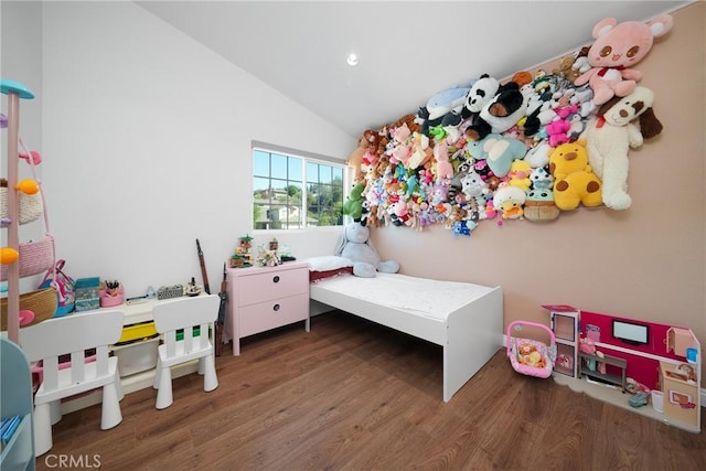 bedroom with recessed lighting, wood finished floors, and lofted ceiling