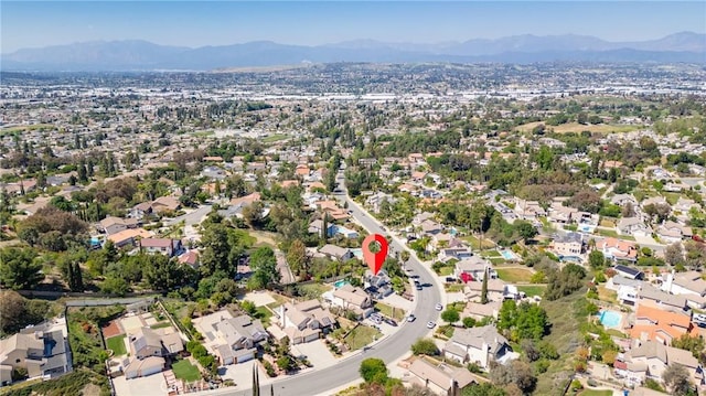 birds eye view of property featuring a residential view and a mountain view