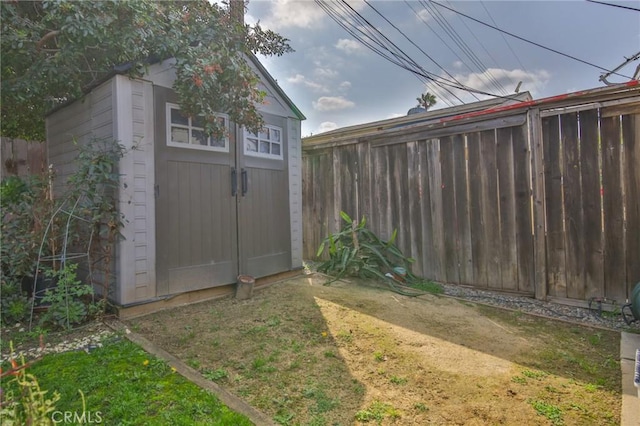 view of shed with fence