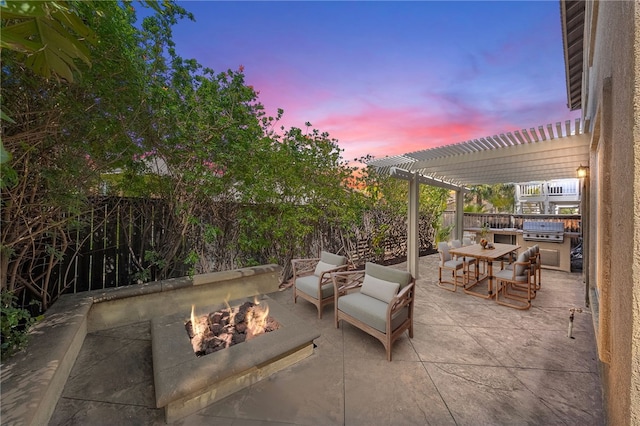 patio terrace at dusk featuring a pergola, a fenced backyard, outdoor dining space, and an outdoor fire pit