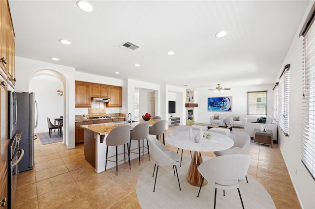 dining space featuring light tile patterned floors, ceiling fan, recessed lighting, and visible vents
