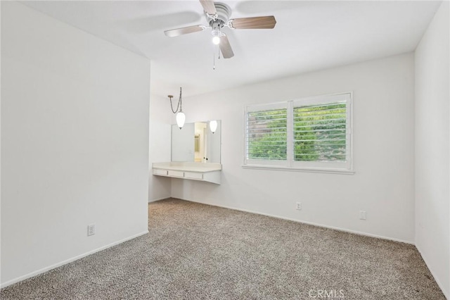 unfurnished bedroom featuring baseboards, carpet, and ceiling fan