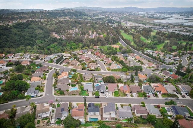 drone / aerial view with a mountain view and a residential view