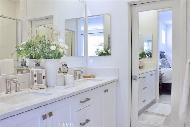 ensuite bathroom featuring ensuite bathroom, a sink, and double vanity