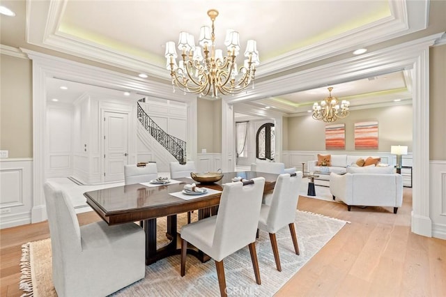 435 Walnut Ave, Arcadia, CA 91007 - dining area featuring a chandelier, a decorative wall, a tray ceiling, crown molding, and stairs
