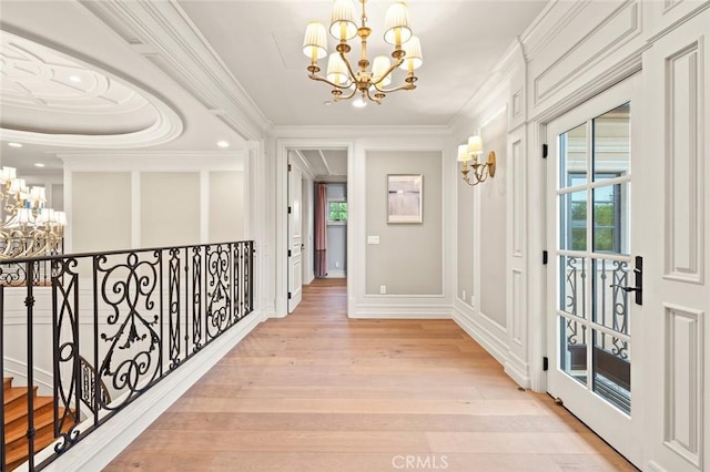 435 Walnut Ave, Arcadia, CA 91007 - hall with a chandelier, ornamental molding, light wood-style flooring, healthy amount of natural light, and recessed lighting