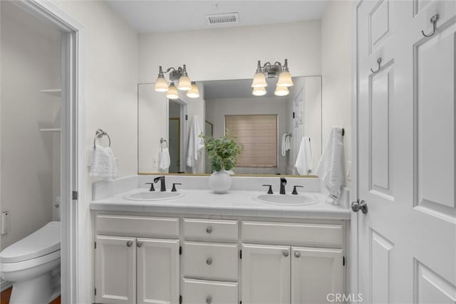 1727 Spreckels Ln, Redondo Beach, CA 90278 - full bath featuring visible vents, a sink, double vanity, and toilet