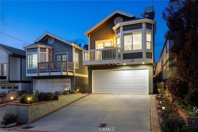 1727 Spreckels Ln, Redondo Beach, CA 90278 - view of front of property with a garage, a balcony, and driveway