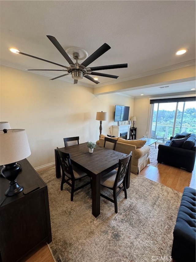 30902 Clubhouse Dr Unit 11J, Laguna Niguel, CA 92677 - dining space featuring wood finished floors, a ceiling fan, visible vents, and crown molding