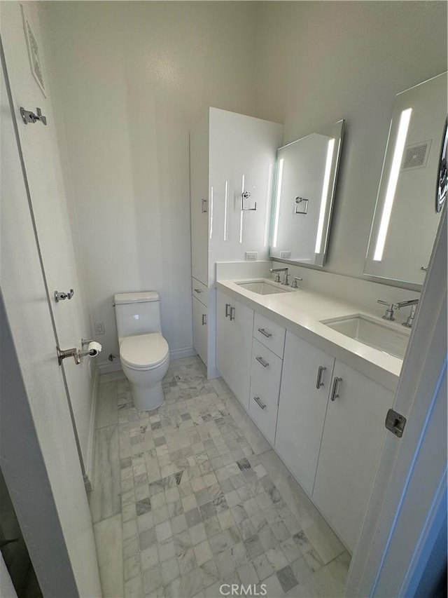 30902 Clubhouse Dr Unit 11J, Laguna Niguel, CA 92677 - full bathroom featuring double vanity, visible vents, toilet, and a sink