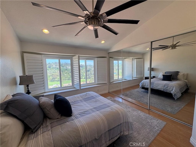 30902 Clubhouse Dr Unit 11J, Laguna Niguel, CA 92677 - bedroom with vaulted ceiling, wood finished floors, ceiling fan, baseboards, and recessed lighting