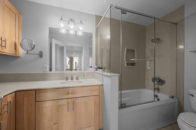 10774 Dabney Dr Unit 17, San Diego, CA 92126 - bathroom featuring toilet, vanity, combined bath / shower with glass door, and tile patterned flooring