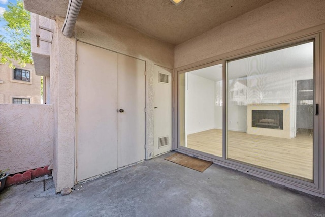 10774 Dabney Dr Unit 17, San Diego, CA 92126 - entrance to property featuring stucco siding and a patio area