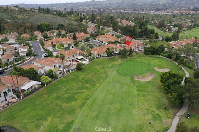 drone / aerial view featuring a residential view and golf course view