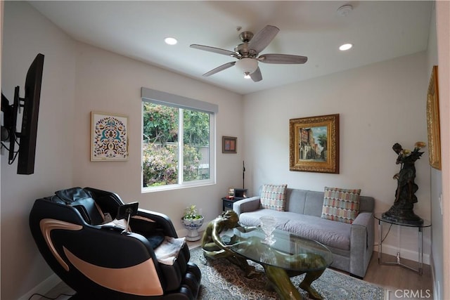 living room with baseboards, a ceiling fan, wood finished floors, and recessed lighting
