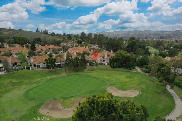 birds eye view of property featuring view of golf course, a residential view, and a mountain view