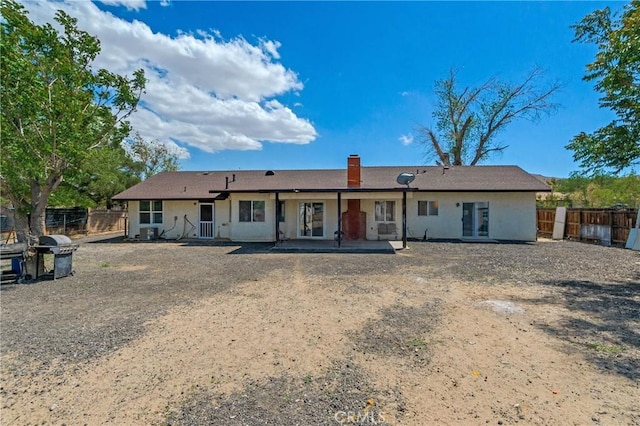 16117 Sweetaire Ave, Lancaster, CA 93535 - rear view of property featuring a chimney, a fenced backyard, and a patio area