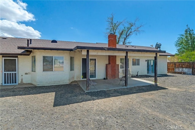 16117 Sweetaire Ave, Lancaster, CA 93535 - rear view of property with stucco siding, a chimney, and a patio area