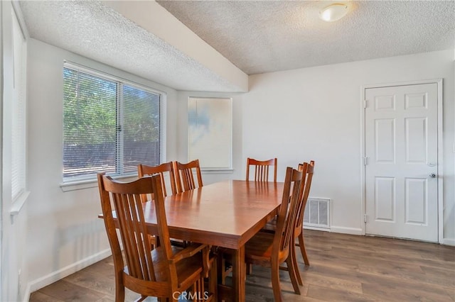 16117 Sweetaire Ave, Lancaster, CA 93535 - dining space with a textured ceiling, wood finished floors, and baseboards