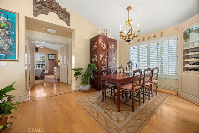 5 Monaco, Dana Point, CA 92629 - dining room featuring vaulted ceiling, a chandelier, and light wood-style floors