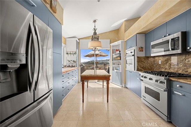 5 Monaco, Dana Point, CA 92629 - kitchen featuring appliances with stainless steel finishes, decorative backsplash, vaulted ceiling, hanging light fixtures, and light tile patterned flooring