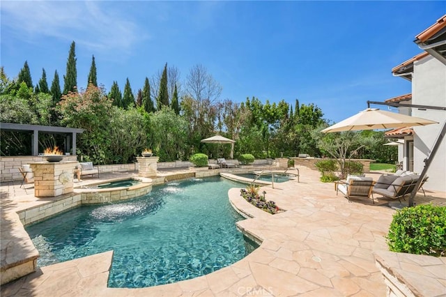 view of pool with a gazebo, a patio area, and a pool with connected hot tub