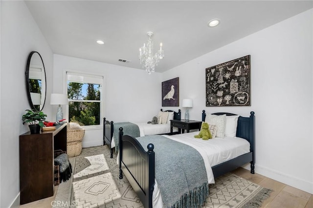 bedroom with a chandelier, visible vents, baseboards, and recessed lighting